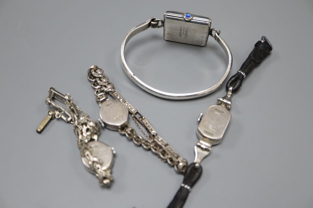 Three ladys assorted silver cocktail wrist watches and a sterling watch.